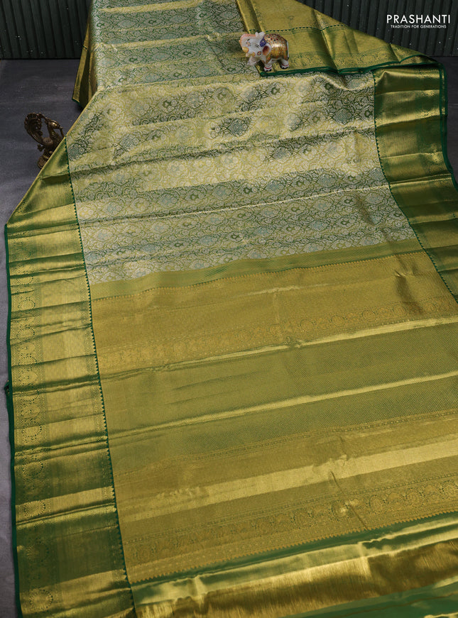 Pure kanchipuram tissue silk saree light green and green with allover zari woven brocade weaves and long rich zari woven border