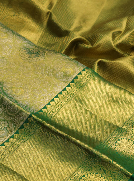 Pure kanchipuram tissue silk saree light green and green with allover zari woven brocade weaves and long rich zari woven border