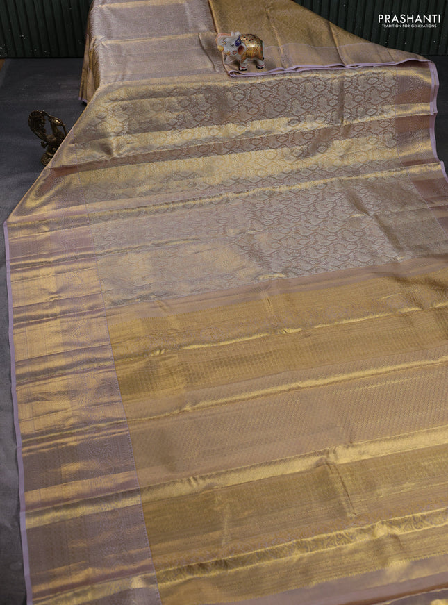 Pure kanchipuram tissue silk saree gold and pastel lavender with allover zari woven brocade weaves and long rich zari woven border