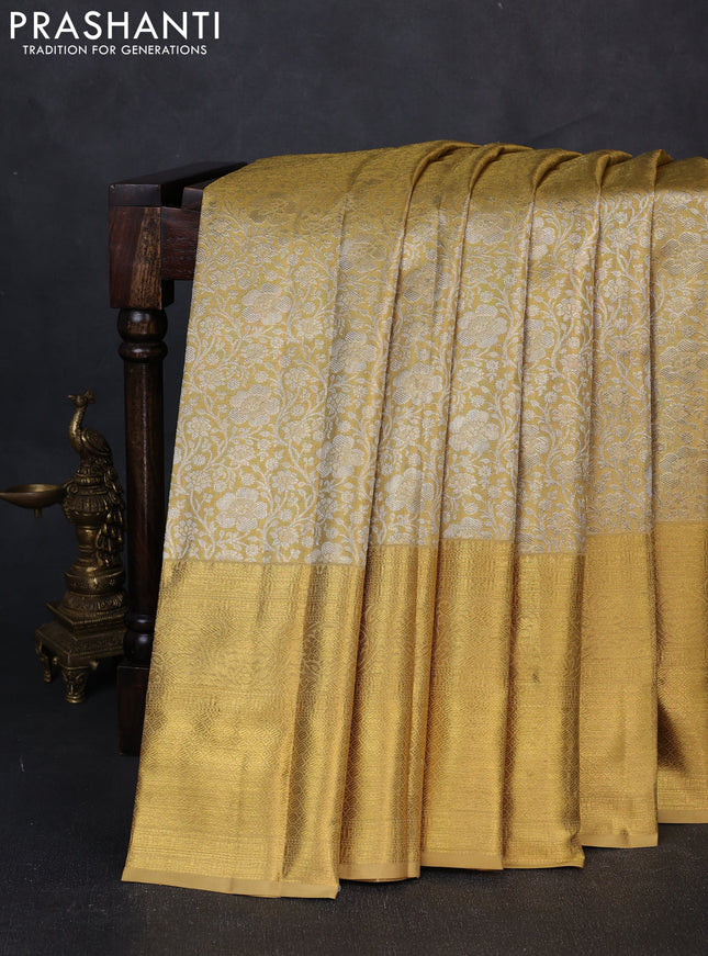 Pure kanchipuram tissue silk saree gold with allover silver zari woven brocade weaves and long rich zari woven border