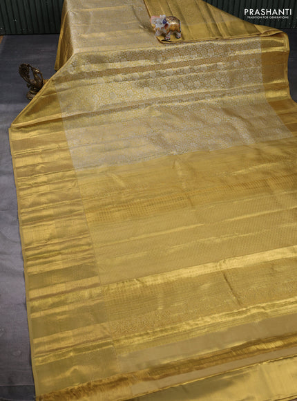 Pure kanchipuram tissue silk saree gold with allover silver zari woven brocade weaves and long rich zari woven border