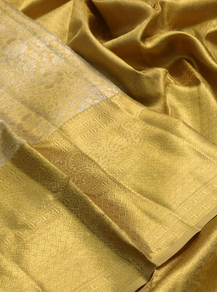Pure kanchipuram tissue silk saree gold with allover silver zari woven brocade weaves and long rich zari woven border