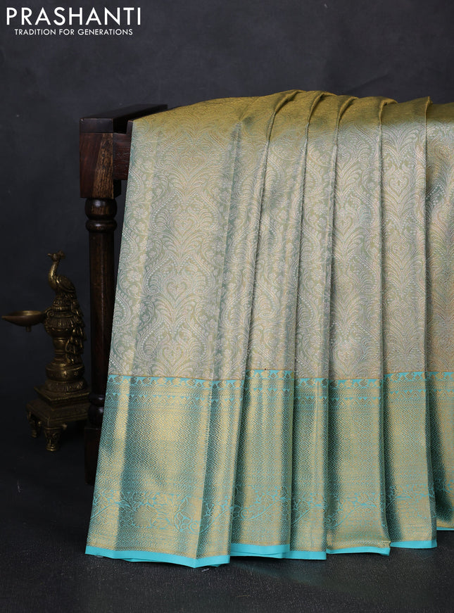 Pure kanchipuram tissue silk saree dual shade of teal with allover zari woven brocade weaves and rich zari woven border