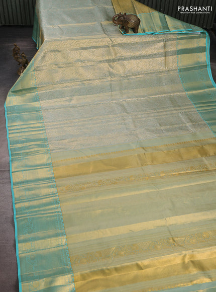 Pure kanchipuram tissue silk saree dual shade of teal with allover zari woven brocade weaves and rich zari woven border