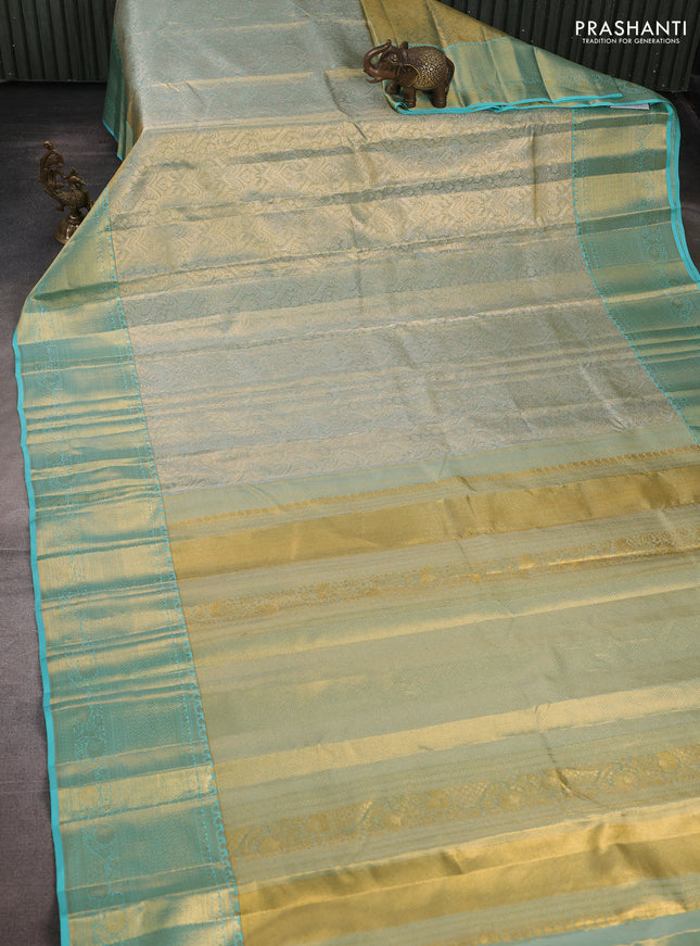 Pure kanchipuram tissue silk saree dual shade of teal with allover zari woven brocade weaves and rich zari woven border