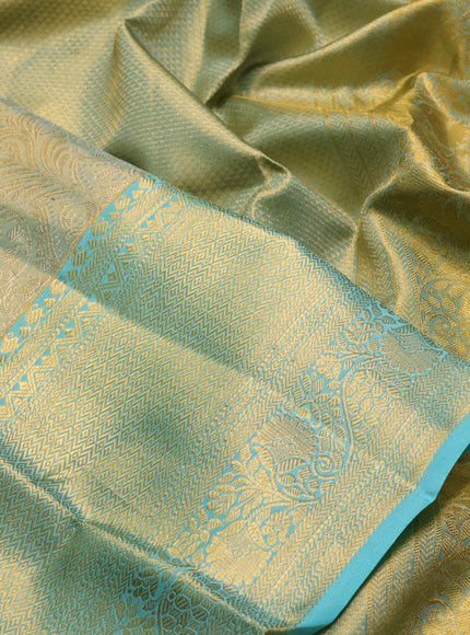 Pure kanchipuram tissue silk saree dual shade of teal with allover zari woven brocade weaves and rich zari woven border