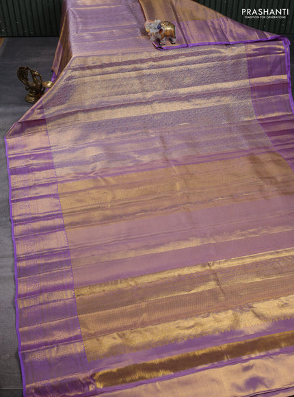 Pure kanchipuram tissue silk saree golden lavender with allover zari woven geometric brocade weaves and rich zari woven border
