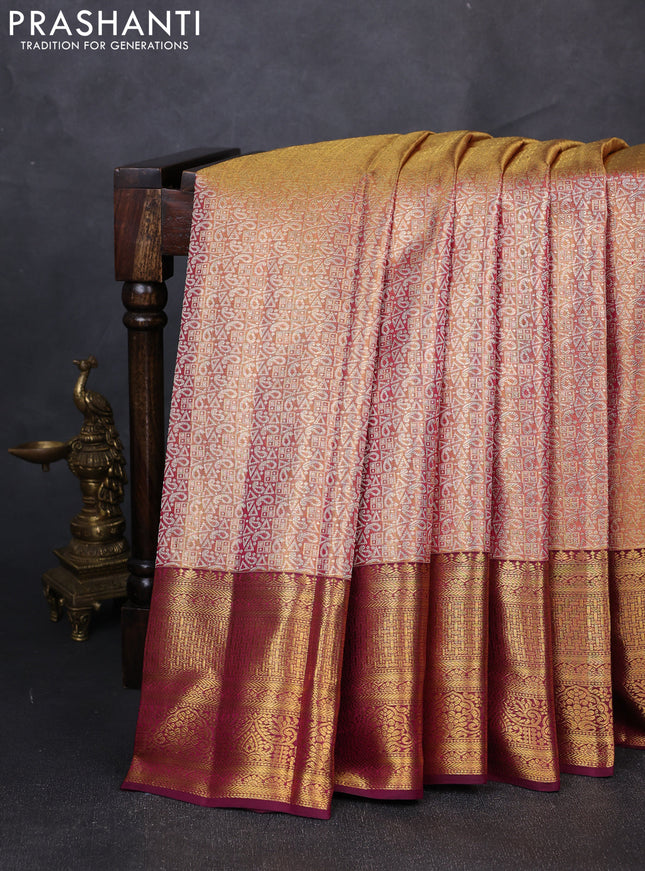 Pure kanchipuram tissue silk saree dual shade of gold and wine shade with allover zari woven geometric brocade weaves and rich zari woven border