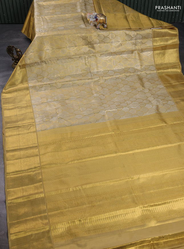 Pure kanchipuram tissue silk saree gold with allover zari woven brocade weaves and rich zari woven border