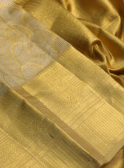 Pure kanchipuram tissue silk saree gold with allover zari woven brocade weaves and rich zari woven border