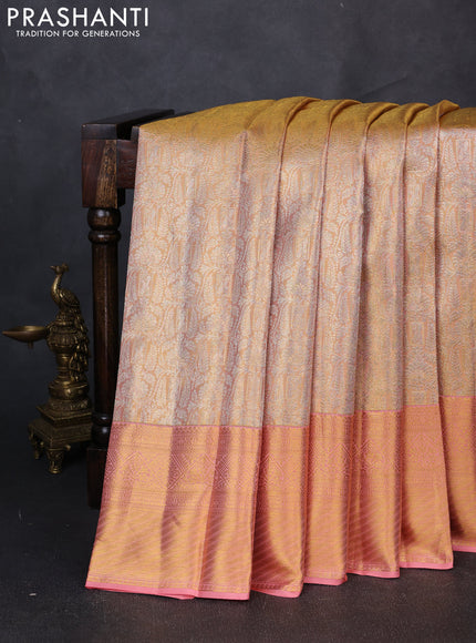 Pure kanchipuram tissue silk saree dual shade of peach with allover zari woven brocade weaves and rich zari woven border