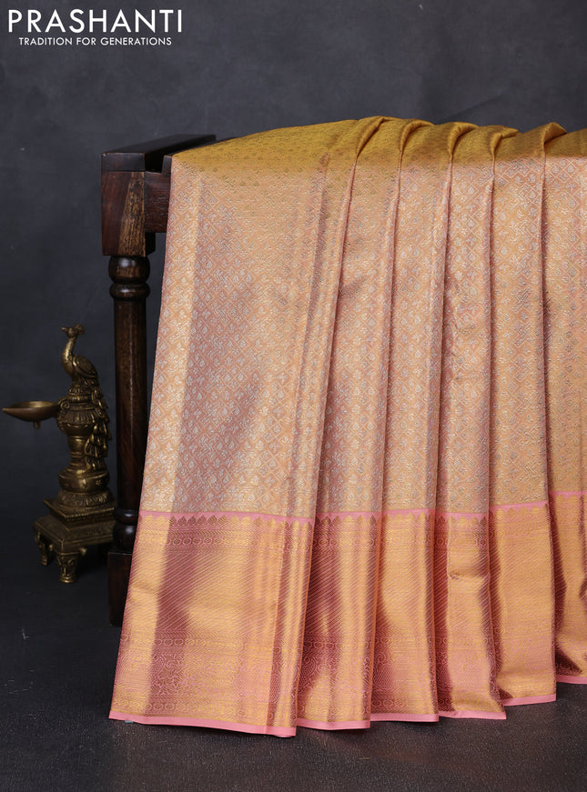 Pure kanchipuram tissue silk saree dual shade of peach with allover zari woven brocade weaves and rich zari woven border