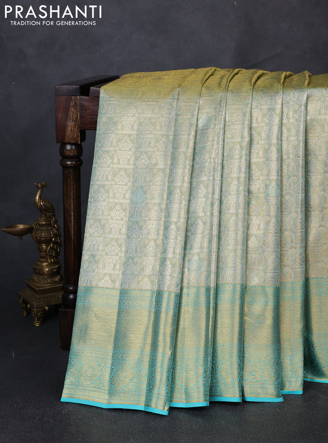 Pure kanchipuram tissue silk saree dual shade of teal and teal blue with allover zari woven brocade weaves and rich zari woven border
