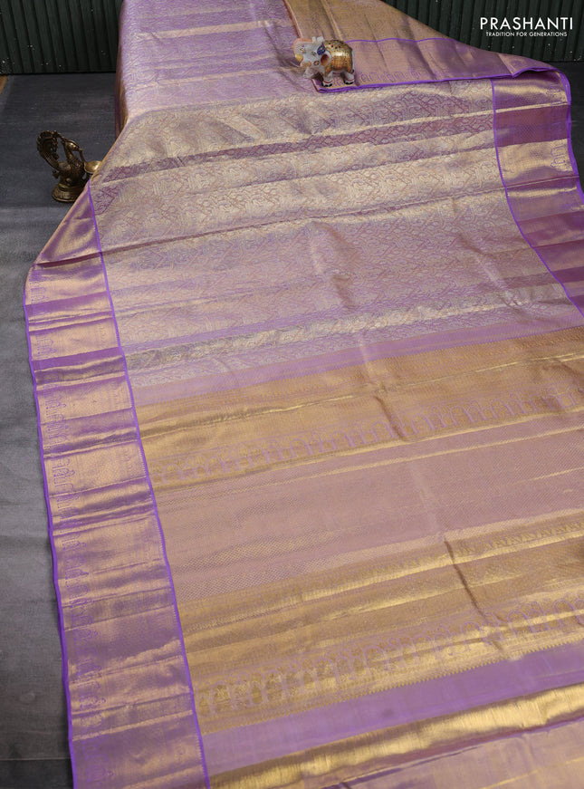 Pure kanchipuram tissue silk saree dual shade of mild lavender and lavender with allover zari woven brocade weaves and rich zari woven border