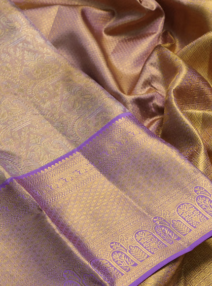 Pure kanchipuram tissue silk saree dual shade of mild lavender and lavender with allover zari woven brocade weaves and rich zari woven border