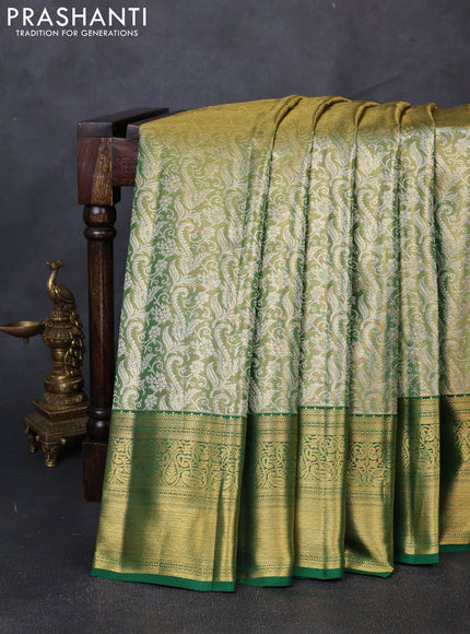 Pure kanchipuram tissue silk saree light green and green with allover zari woven brocade weaves and rich zari woven border