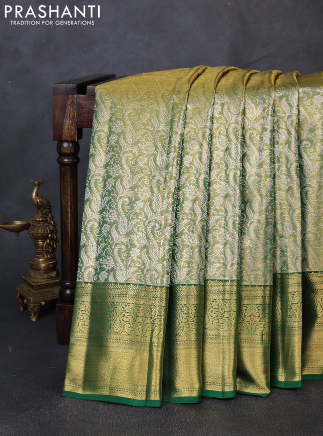 Pure kanchipuram tissue silk saree light green and green with allover zari woven brocade weaves and rich zari woven border