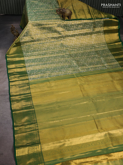 Pure kanchipuram tissue silk saree light green and green with allover zari woven brocade weaves and rich zari woven border