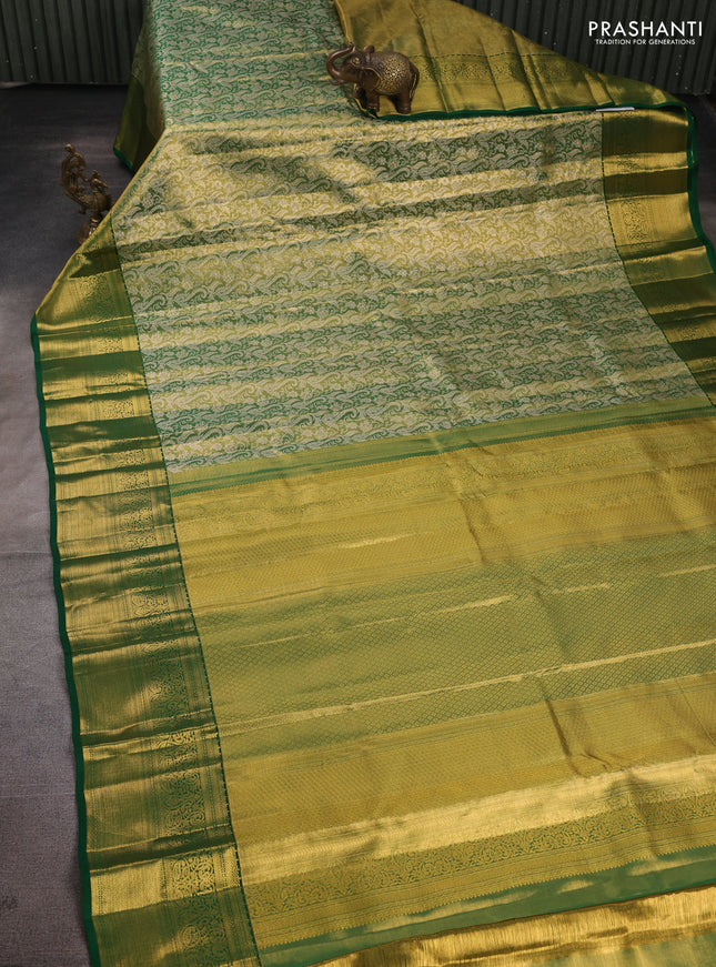 Pure kanchipuram tissue silk saree light green and green with allover zari woven brocade weaves and rich zari woven border