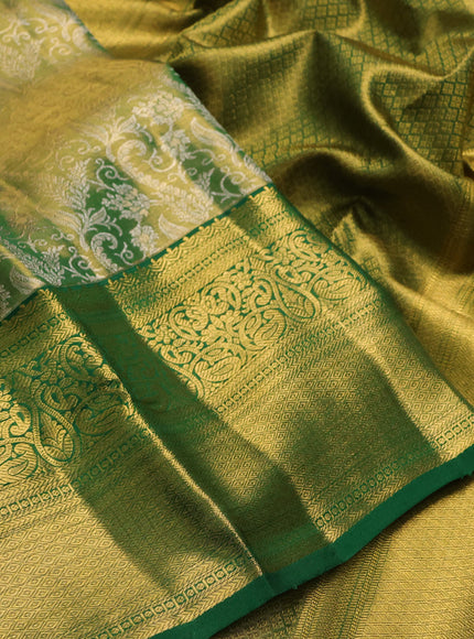 Pure kanchipuram tissue silk saree light green and green with allover zari woven brocade weaves and rich zari woven border