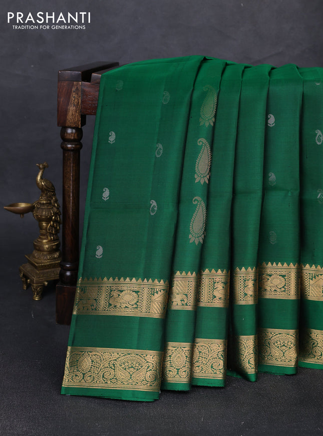 Pure soft silk saree green with allover zari woven paisley buttas and rettapet zari woven border