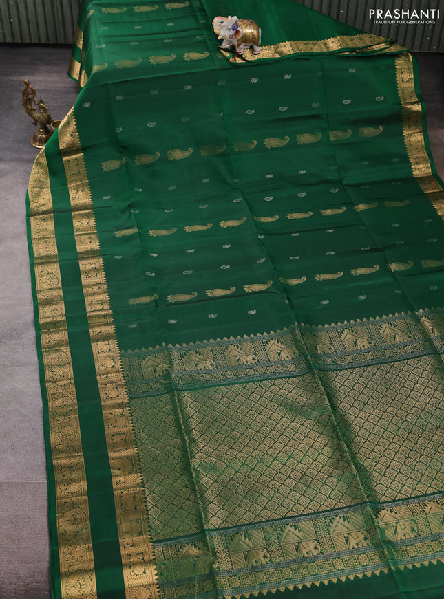 Pure soft silk saree green with allover zari woven paisley buttas and rettapet zari woven border