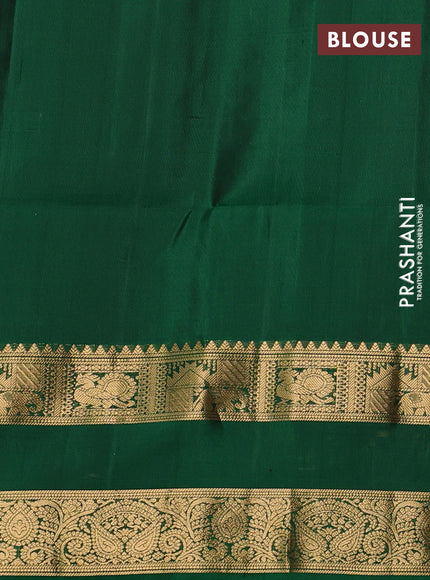 Pure soft silk saree green with allover zari woven paisley buttas and rettapet zari woven border