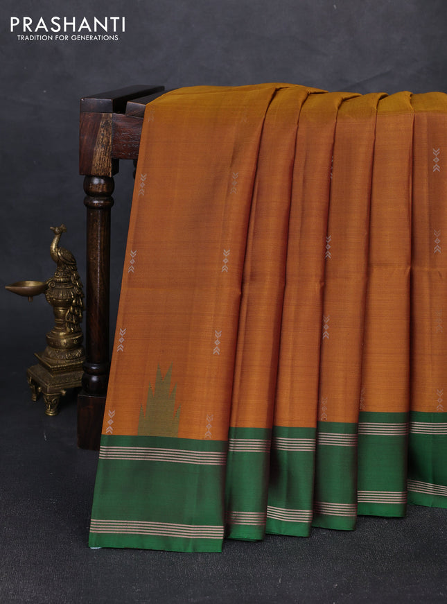 Pure soft silk saree dark mustard and green with zari woven buttas and rettapet zari woven border