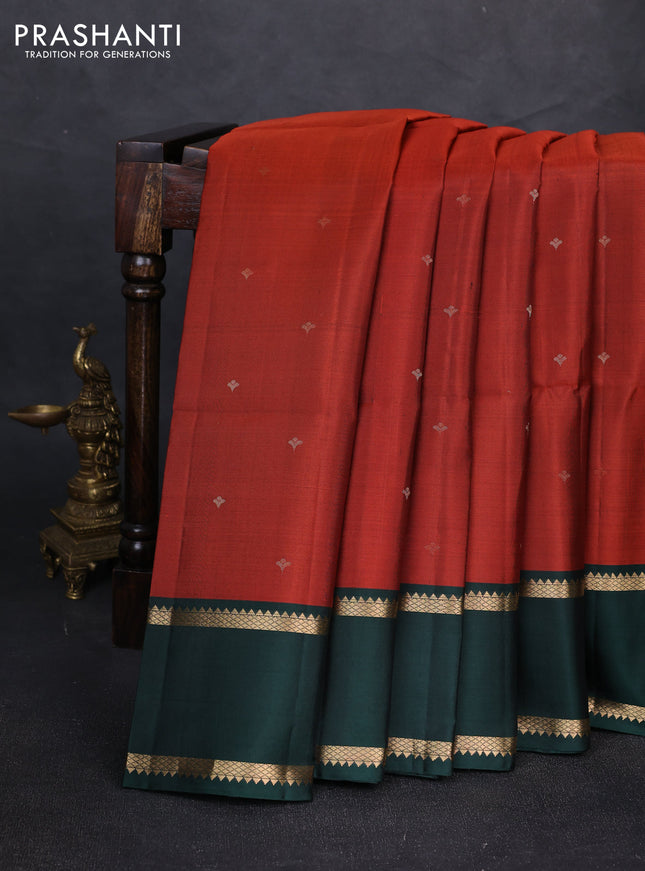 Pure soft silk saree rustic orange and bottle green with allover zari woven buttas and zari woven border