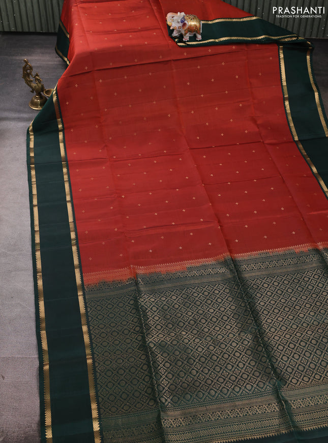 Pure soft silk saree rustic orange and bottle green with allover zari woven buttas and zari woven border