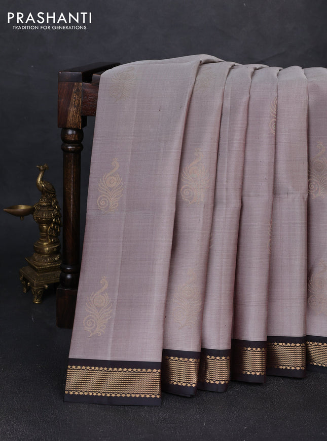 Pure soft silk saree grey shade and dual shade of bottle green with zari woven buttas and zari woven border