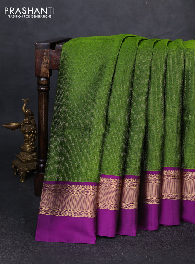 Pure soft silk saree mehendi green and purple with allover self emboss & zari weaves and zari woven simple border