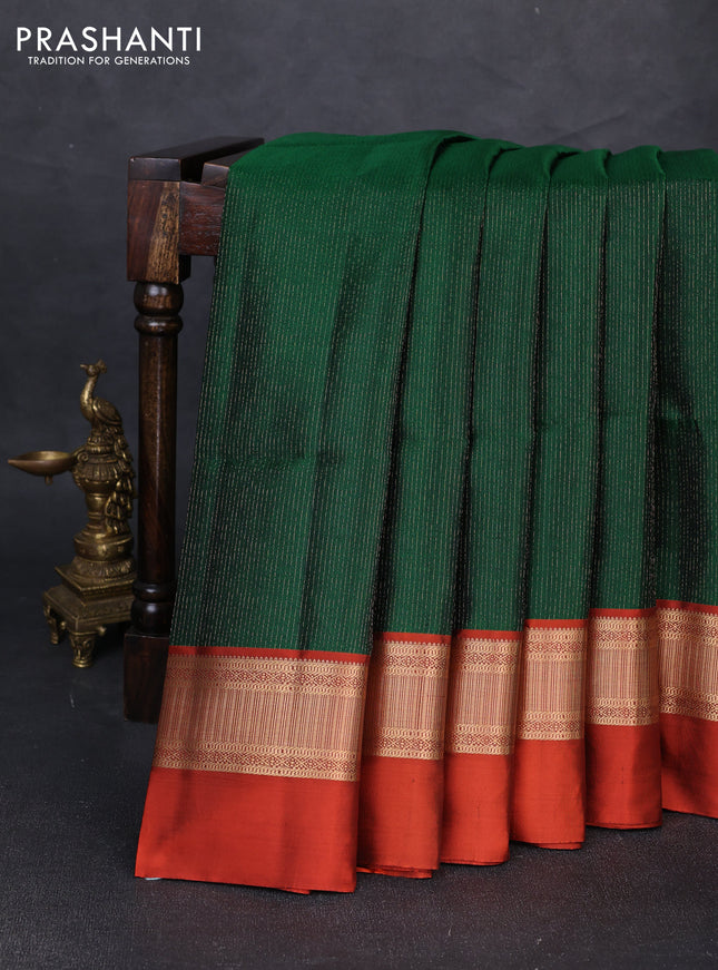 Pure soft silk saree bottle green and rustic orange with allover self emboss & zari weaves and zari woven simple border