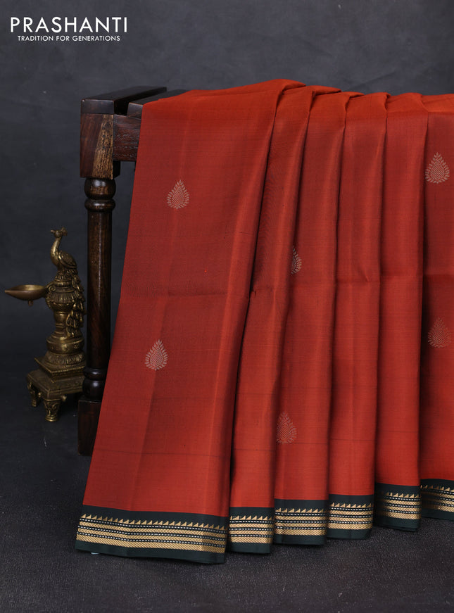 Pure soft silk saree rust shade and bottle green with zari woven buttas and zari woven border