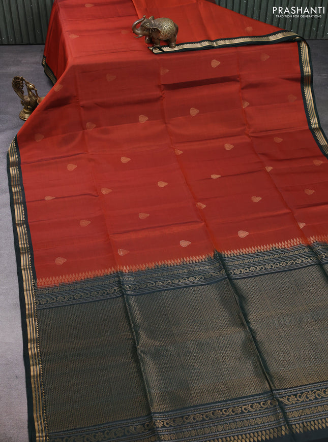 Pure soft silk saree rust shade and bottle green with zari woven buttas and zari woven border