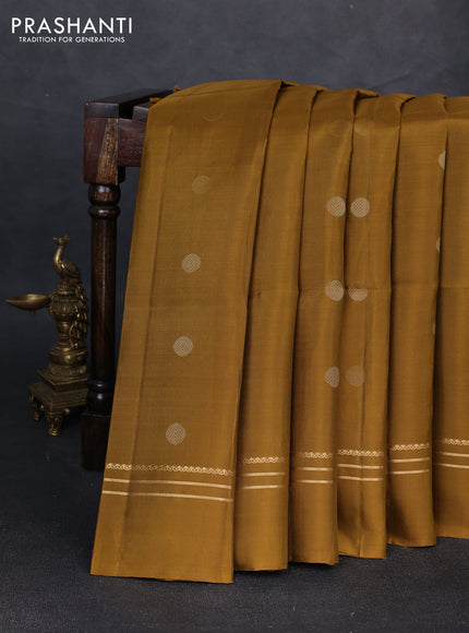 Pure soft silk saree dark mustard with allover rudhraksha zari woven buttas and zari woven simple border