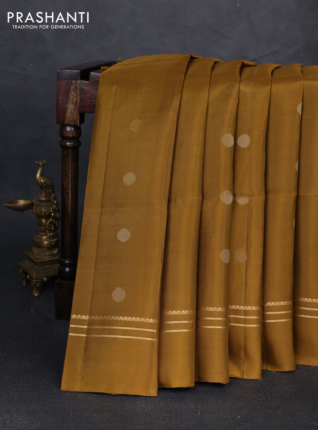 Pure soft silk saree dark mustard with allover rudhraksha zari woven buttas and zari woven simple border