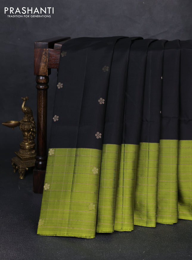 Pure soft silk saree black and mehendi green with allover zari woven floral buttas and long zari woven checked border
