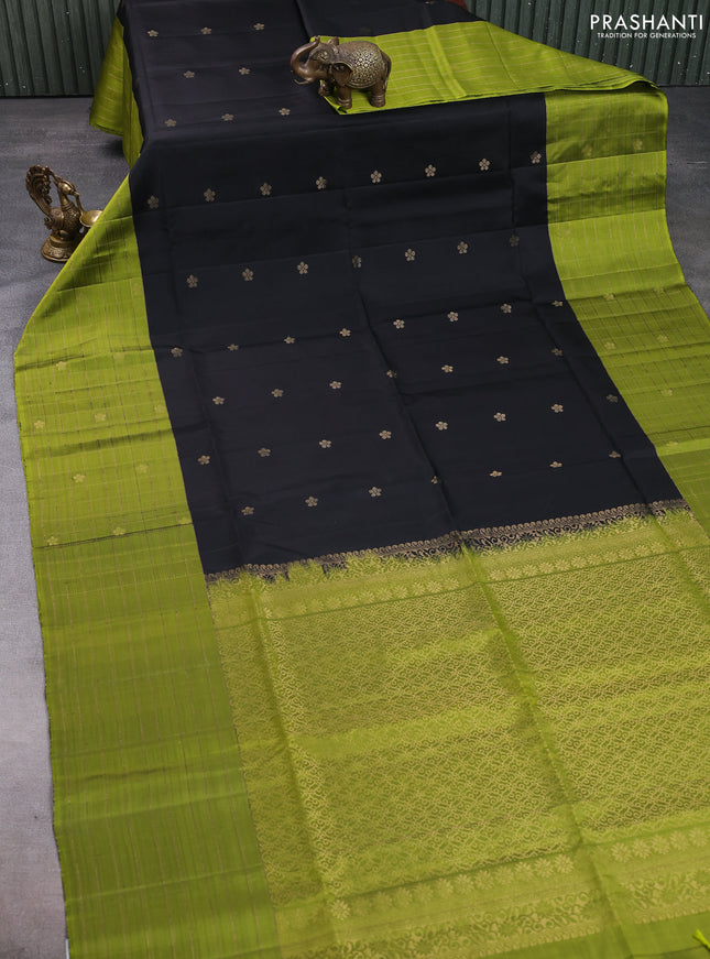 Pure soft silk saree black and mehendi green with allover zari woven floral buttas and long zari woven checked border