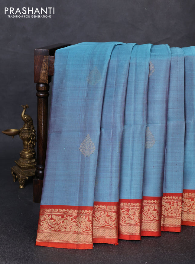 Pure soft silk saree pastel blue and rustic orange with zari woven buttas and rich zari woven border