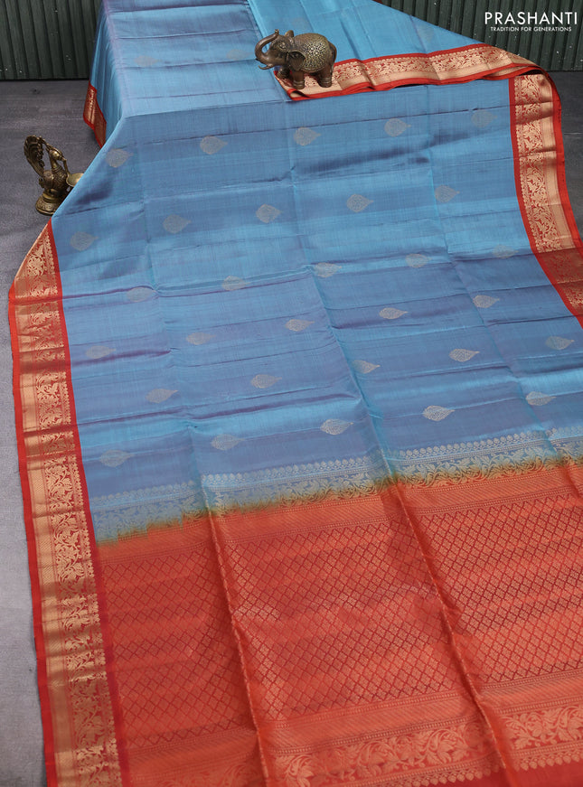 Pure soft silk saree pastel blue and rustic orange with zari woven buttas and rich zari woven border