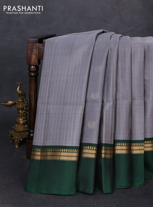 Pure soft silk saree grey and bottle green with allover zari weaves & buttas and zari woven simple border