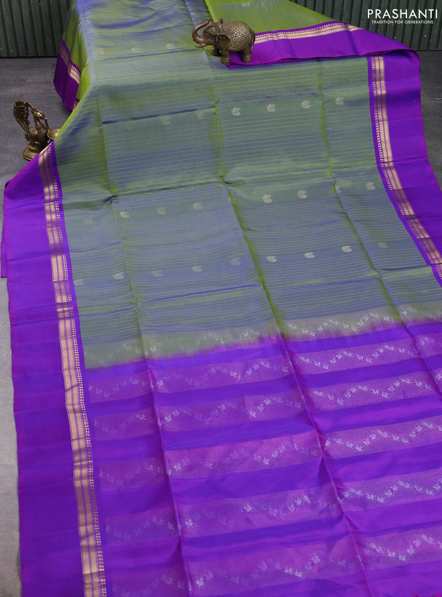 Pure soft silk saree dual shade of green and purple with allover zari weaves & buttas and zari woven simple border