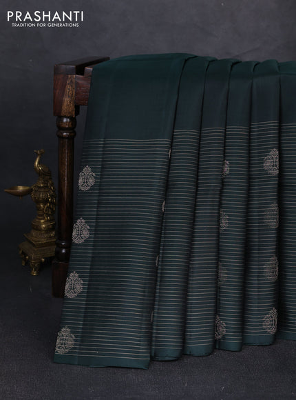 Pure soft silk saree bottle green with plain body and long zari stripe butta border