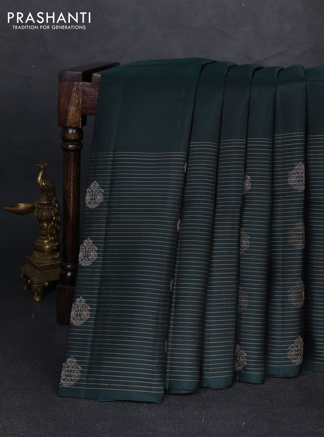 Pure soft silk saree bottle green with plain body and long zari stripe butta border