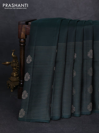 Pure soft silk saree bottle green with plain body and long zari stripe butta border