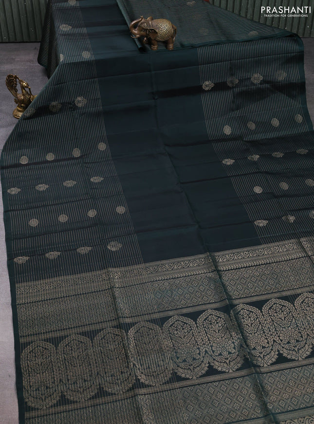 Pure soft silk saree bottle green with plain body and long zari stripe butta border