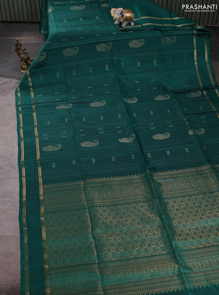 Pure soft silk saree teal green with allover zari weaves & buttas and rettapet zari woven border