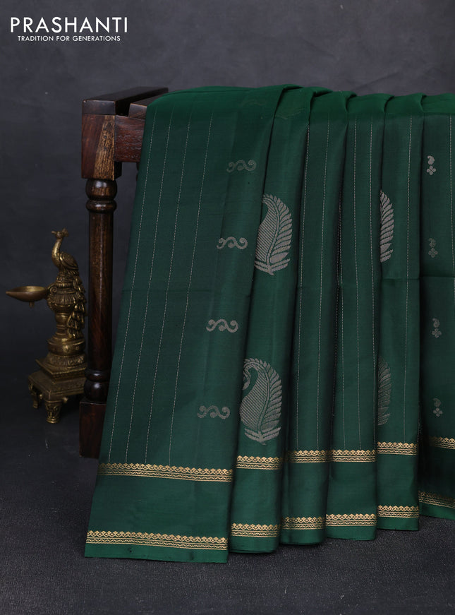 Pure soft silk saree bottle green with allover zari weaves & buttas and rettapet zari woven border