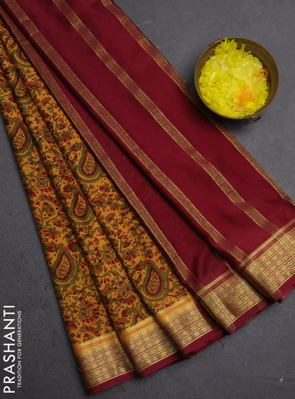 Semi mysore silk saree sandal and deep maroon with allover prints and small zari woven border